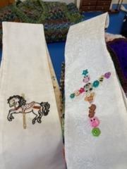Stoles made Beverley for her sister in law.  The one with the carousel horse is for when she takes services for fair people and the other one for christenings.